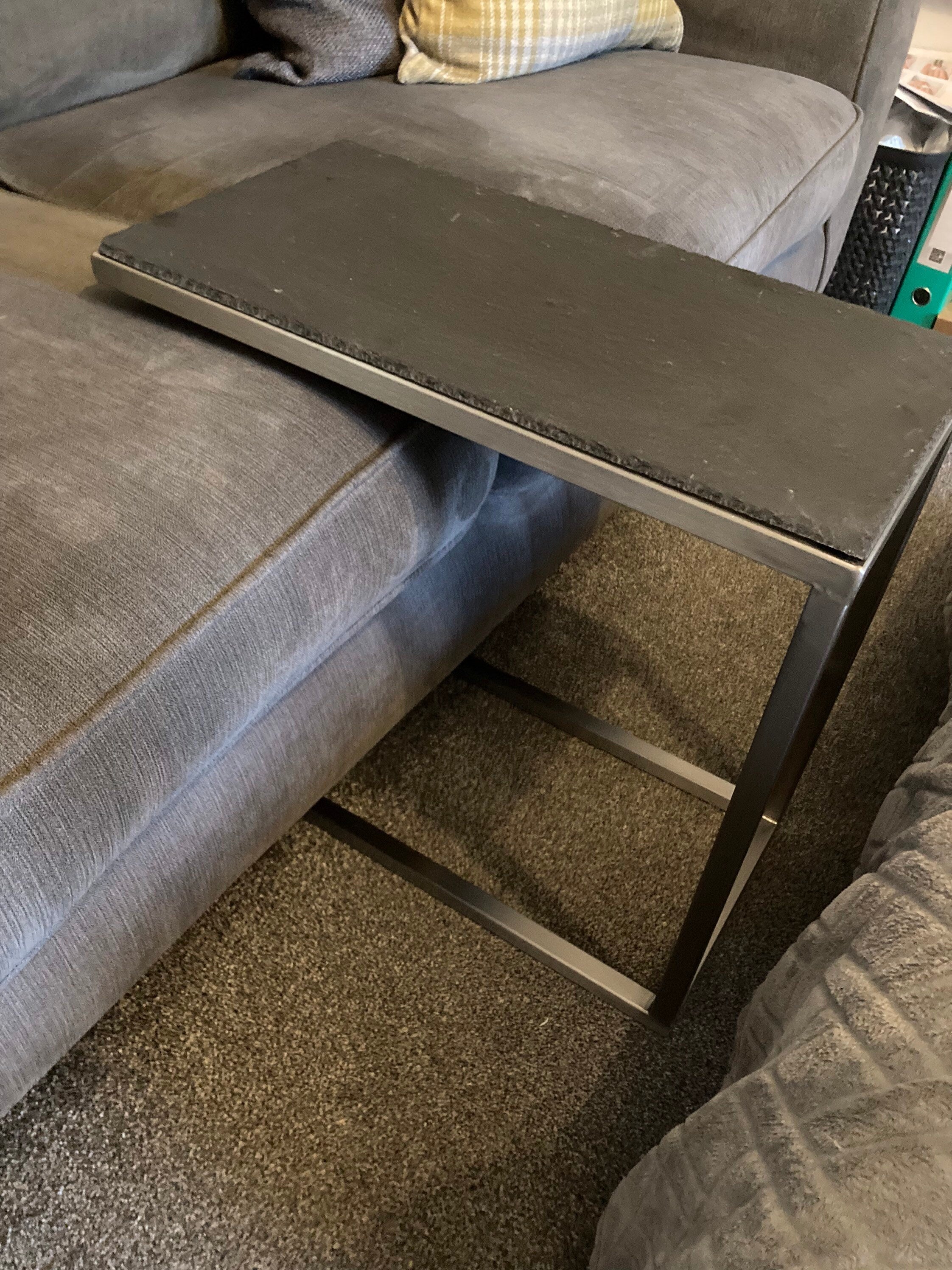 Table that slides under outlet couch